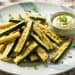 crispy parmesan zucchini fries arranged on a white plate