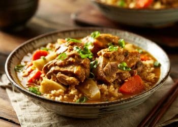 Japanese Coconut Curry Braised Pork Thighs served in a rustic bowl over white rice