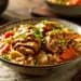Japanese Coconut Curry Braised Pork Thighs served in a rustic bowl over white rice